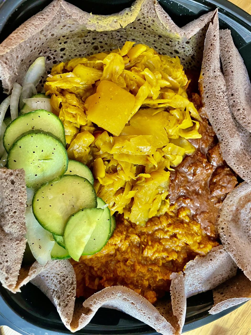 A takeout plate in an open container from the Shaw Market deli counter